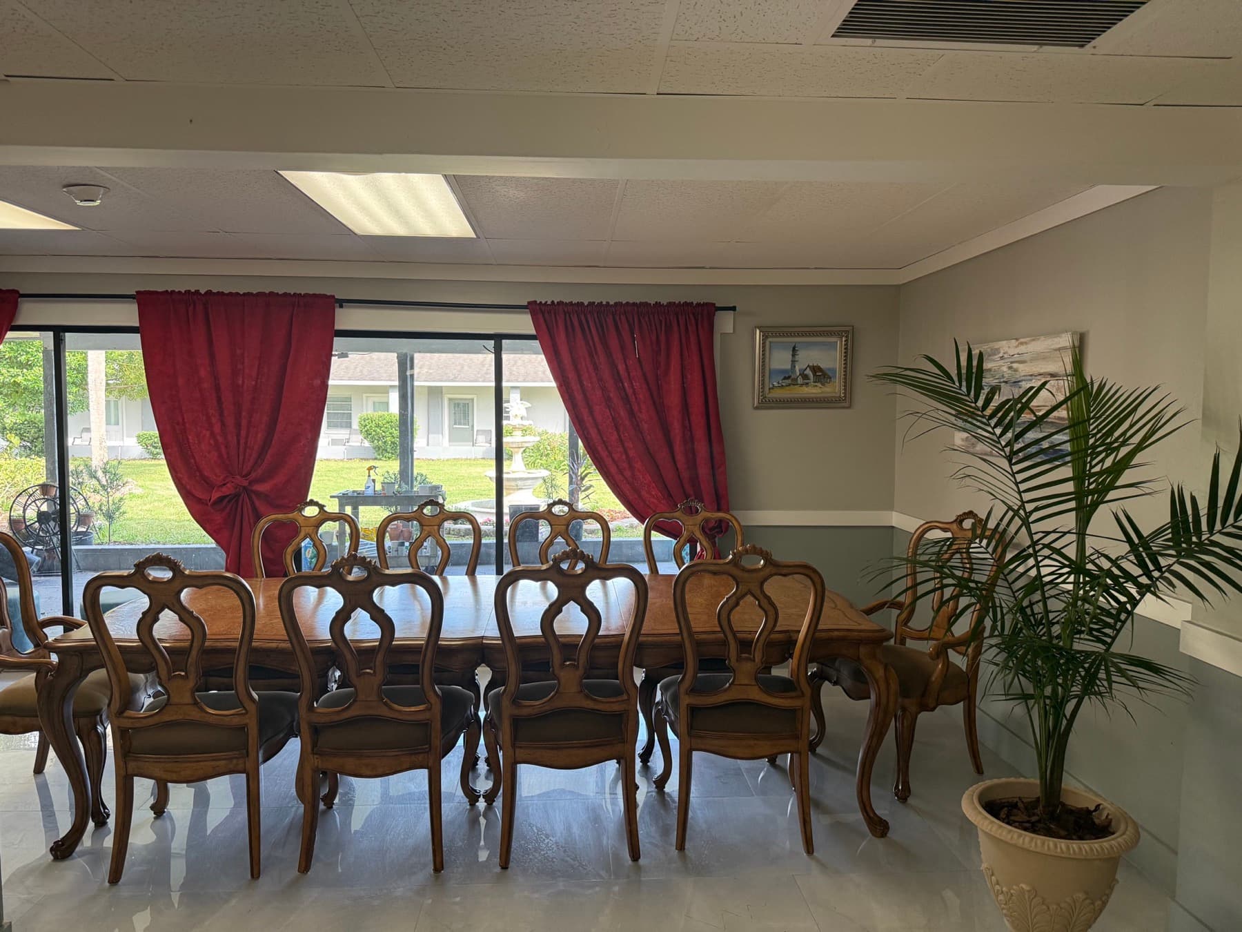 Dining room with a long wooden table and garden view